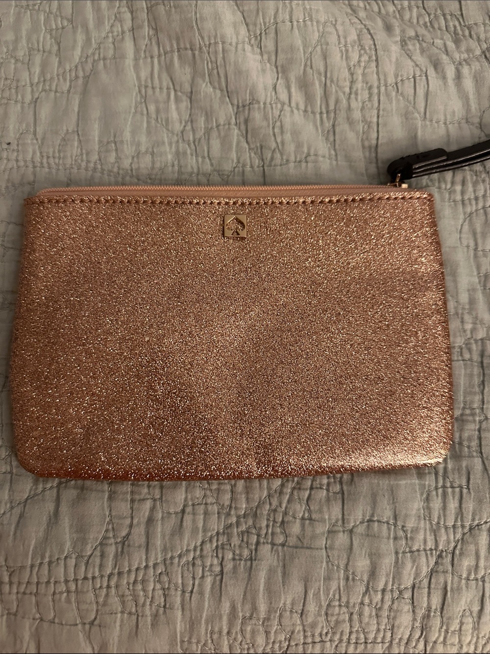 kate spade glitter wristlet in metallic rose